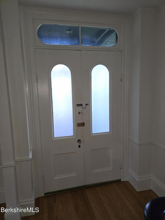 entrance foyer with dark hardwood / wood-style floors