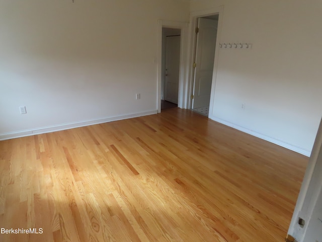 spare room with light wood-type flooring