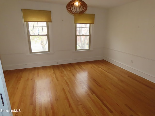 empty room with hardwood / wood-style floors