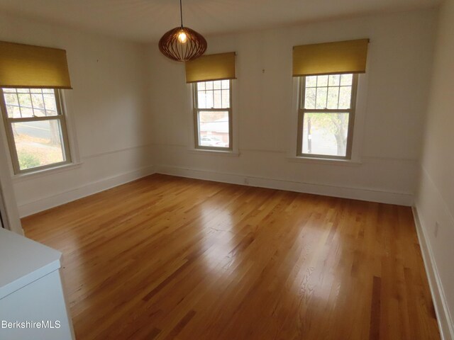 entryway with hardwood / wood-style floors and an inviting chandelier