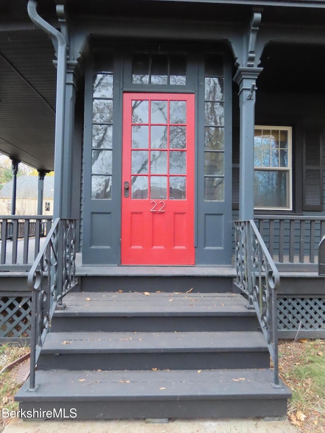 doorway to property featuring covered porch