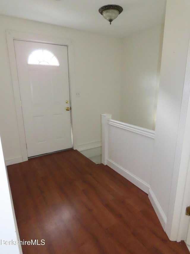 entryway with wood finished floors