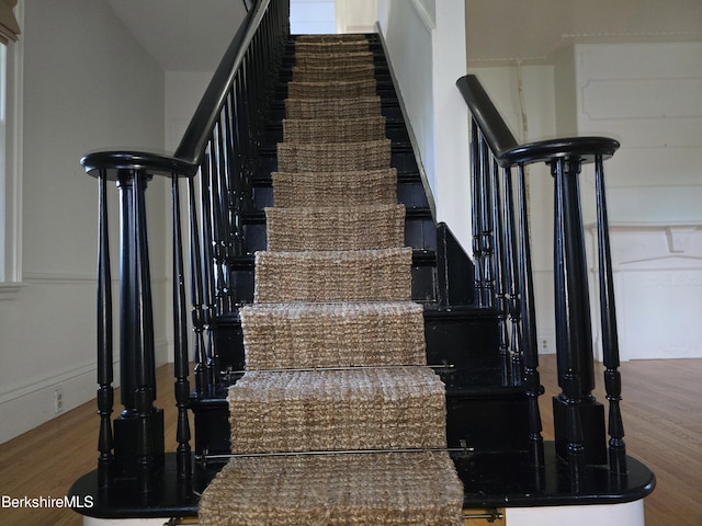 staircase featuring hardwood / wood-style flooring