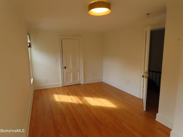 unfurnished room with light hardwood / wood-style floors