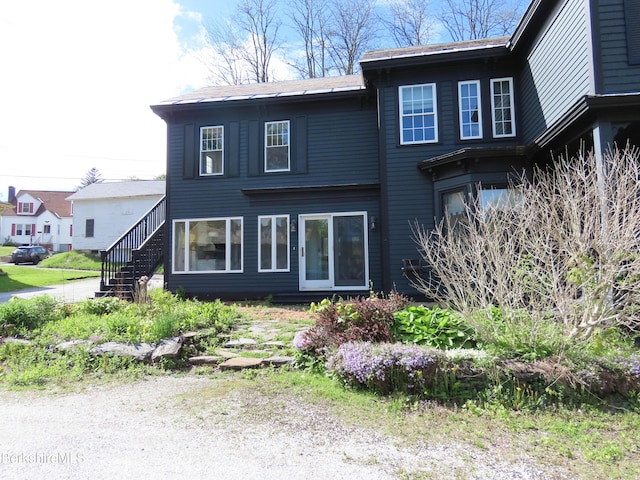 view of front of property with stairway