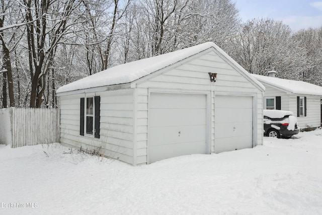 view of snow covered garage