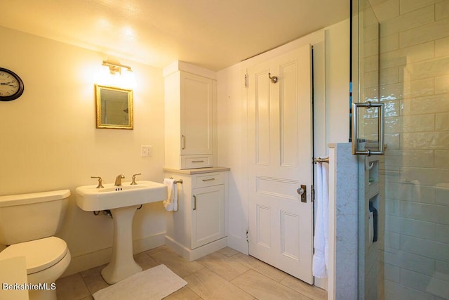 bathroom with tile patterned flooring and toilet