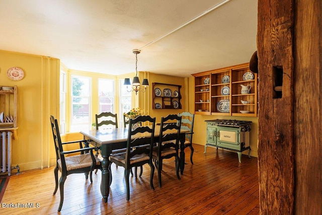 dining room featuring a chandelier and light wood-type flooring