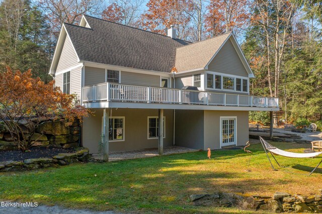 2017 Monterey Rd, Otis, MA 01253 - back of house with a wooden deck, a chimney, a shingled roof, and a yard