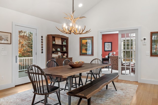 2017 Monterey Rd, Otis, MA 01253 - dining area featuring a chandelier, plenty of natural light, light wood finished floors, high vaulted ceiling, and recessed lighting