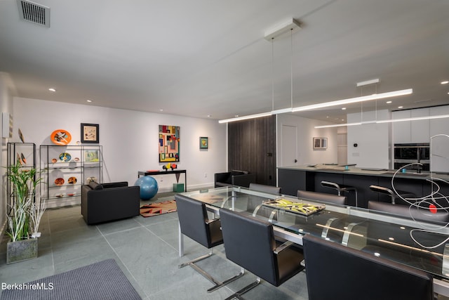 recreation room with light tile patterned floors