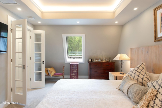 carpeted bedroom featuring recessed lighting, a raised ceiling, visible vents, and crown molding