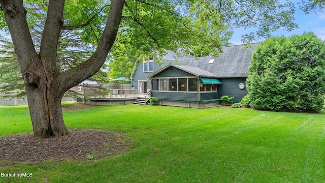 51 New Lenox Rd, Lenox, MA 01240 - back of property with a wooden deck, a lawn, a shingled roof, and a sunroom