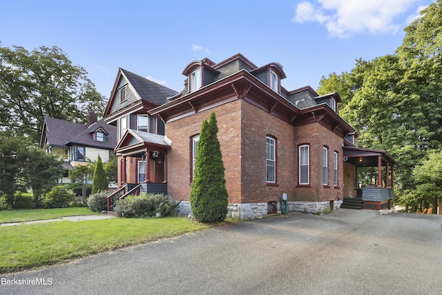 view of home's exterior with a yard