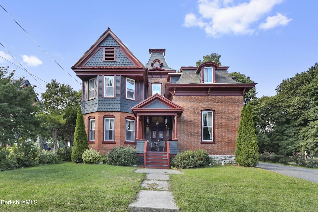 victorian house with a front lawn