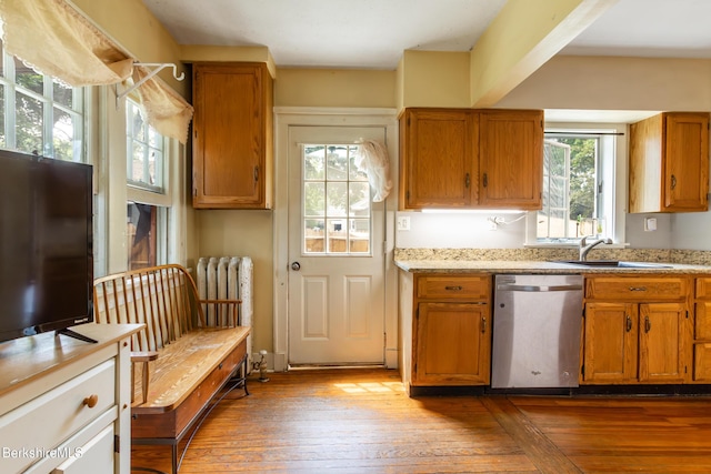 30 Belvidere Ave, Pittsfield, MA 01201 - kitchen featuring stainless steel dishwasher, hardwood / wood-style floors, and brown cabinetry