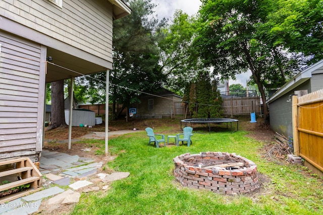 30 Belvidere Ave, Pittsfield, MA 01201 - fenced backyard featuring an outdoor fire pit and a trampoline
