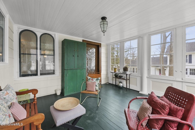 sunroom / solarium featuring wood finished floors