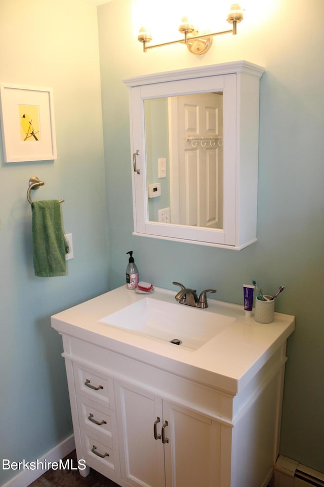 bathroom featuring vanity and a baseboard heating unit