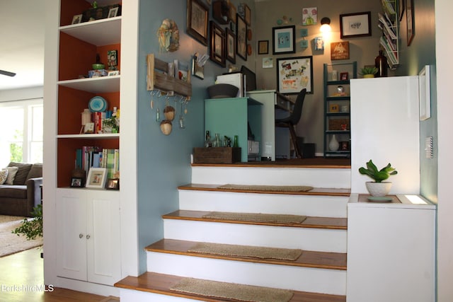 stairs with wood-type flooring