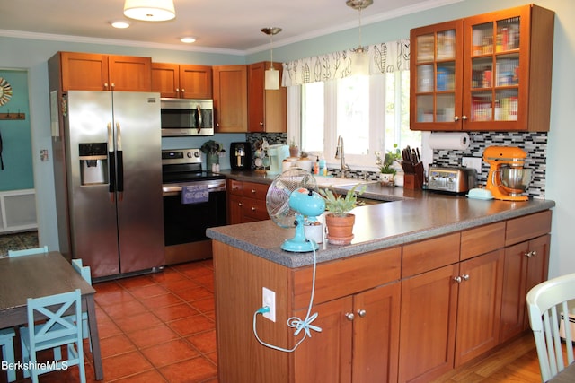 kitchen featuring stainless steel appliances, crown molding, pendant lighting, decorative backsplash, and light tile patterned floors