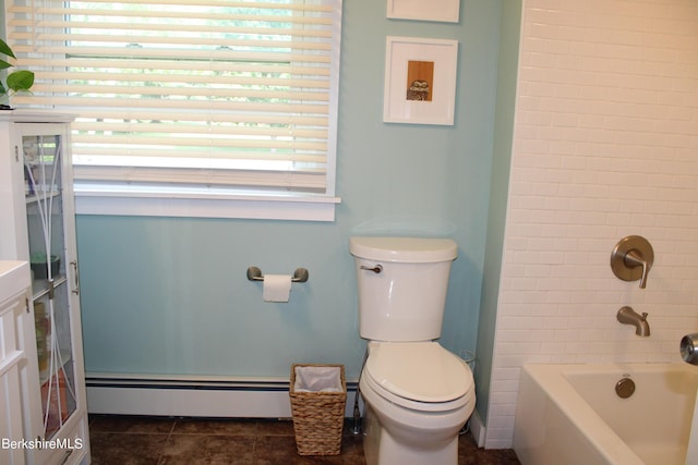 full bathroom with vanity, toilet, baseboard heating, and tiled shower / bath combo