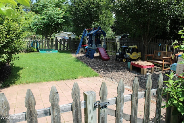 view of yard with a playground and a patio