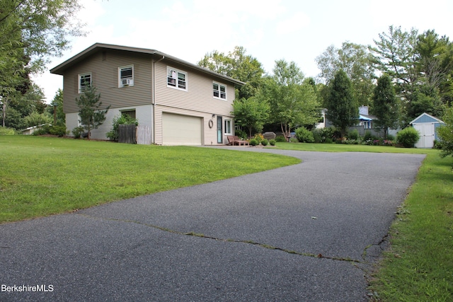 view of front property with a garage and a front yard