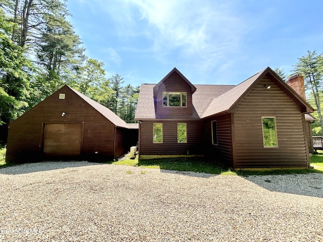 20 Hillside Ln, Sheffield, MA 01222 - chalet / cabin with a detached garage, gravel driveway, an outdoor structure, a chimney, and a shingled roof