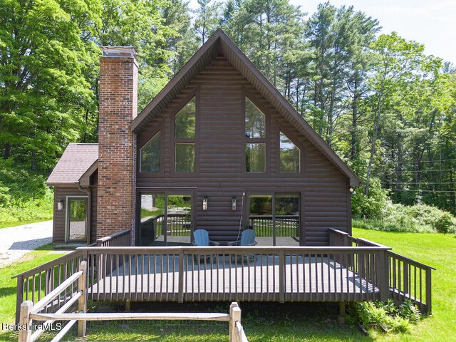 20 Hillside Ln, Sheffield, MA 01222 - back of house with a chimney, a deck, faux log siding, and a yard
