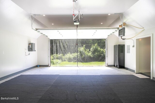 20 Hillside Ln, Sheffield, MA 01222 - garage featuring baseboards, recessed lighting, electric panel, a heating unit, and a garage door opener