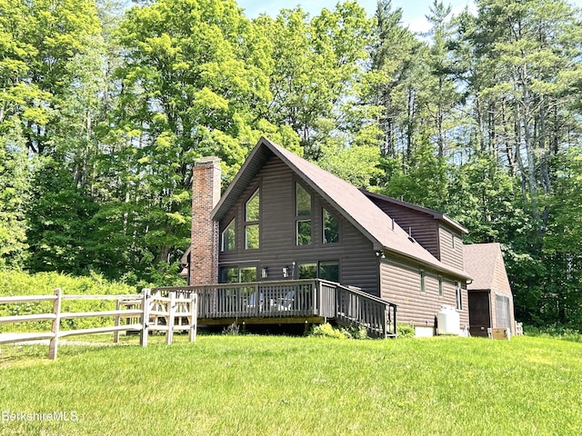 20 Hillside Ln, Sheffield, MA 01222 - rear view of house with a chimney, a wooden deck, and log veneer siding