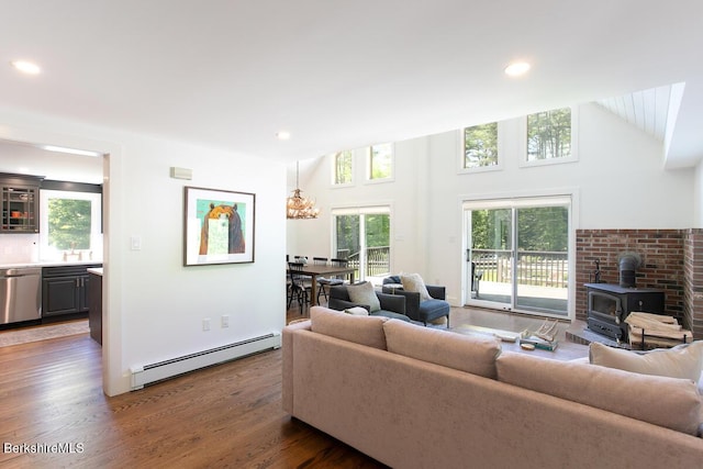 20 Hillside Ln, Sheffield, MA 01222 - living room with a baseboard heating unit, a wood stove, dark wood finished floors, lofted ceiling, and recessed lighting