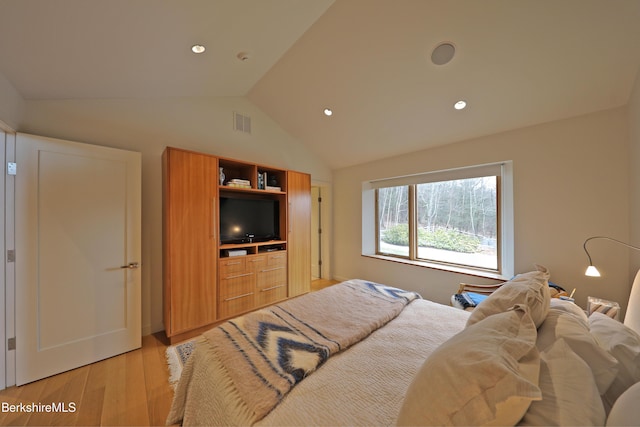 bedroom with visible vents, recessed lighting, light wood-type flooring, and vaulted ceiling