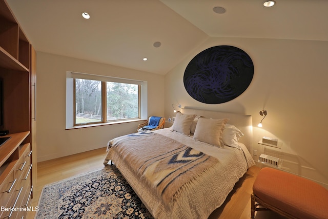 bedroom featuring recessed lighting, baseboards, light wood-style flooring, and vaulted ceiling