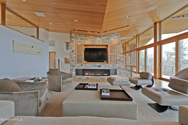 113 Brush Hill Rd, Great Barrington, MA 01230 - living area with a fireplace, wooden ceiling, and high vaulted ceiling