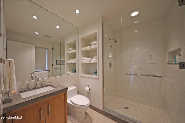 full bathroom with visible vents, toilet, a stall shower, recessed lighting, and vanity