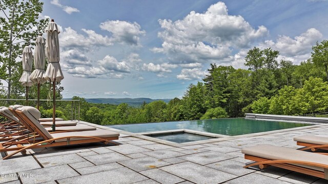113 Brush Hill Rd, Great Barrington, MA 01230 - view of pool with an in-ground hot tub, a patio, and an infinity pool
