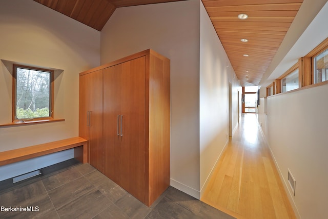 corridor with visible vents, recessed lighting, baseboards, wood ceiling, and vaulted ceiling