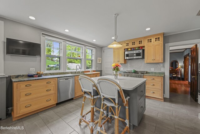 68 Colt Rd, Pittsfield, MA 01201 - kitchen featuring appliances with stainless steel finishes, backsplash, a kitchen island, glass insert cabinets, and a sink