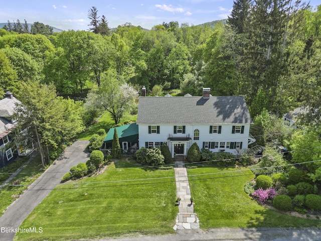 68 Colt Rd, Pittsfield, MA 01201 - view of front of home featuring a front lawn, a chimney, driveway, and roof with shingles