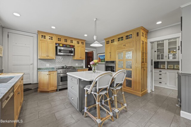 68 Colt Rd, Pittsfield, MA 01201 - kitchen featuring appliances with stainless steel finishes, backsplash, recessed lighting, a center island, and a breakfast bar