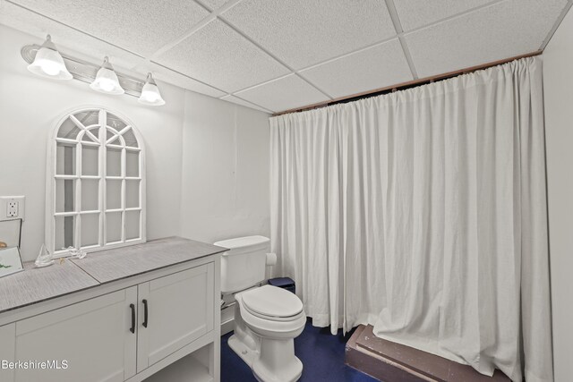 68 Colt Rd, Pittsfield, MA 01201 - bathroom with a paneled ceiling, toilet, vanity, and curtained shower