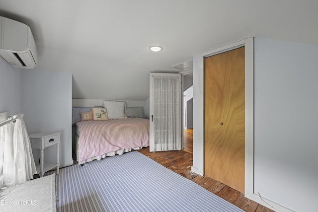 68 Colt Rd, Pittsfield, MA 01201 - bedroom featuring an AC wall unit, wood finished floors, and recessed lighting