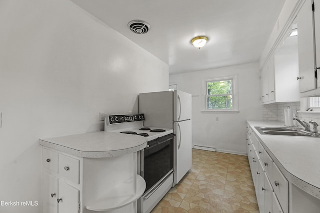 kitchen with white appliances, a baseboard heating unit, a sink, white cabinetry, and light countertops