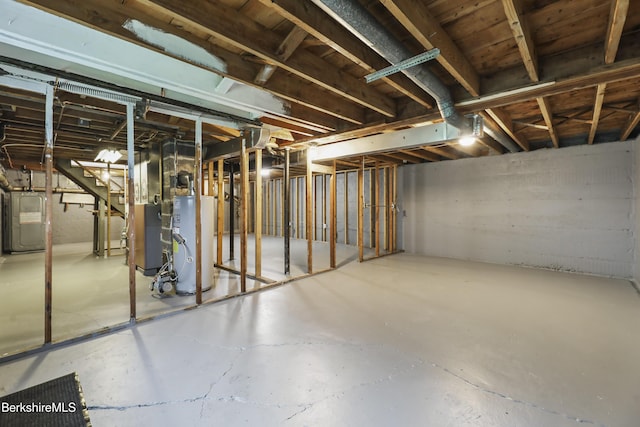 unfinished below grade area with water heater and heating unit