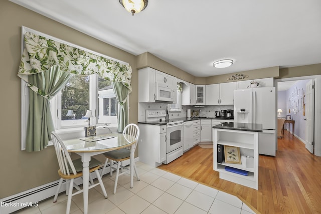 kitchen featuring white appliances, white cabinets, open shelves, tasteful backsplash, and dark countertops