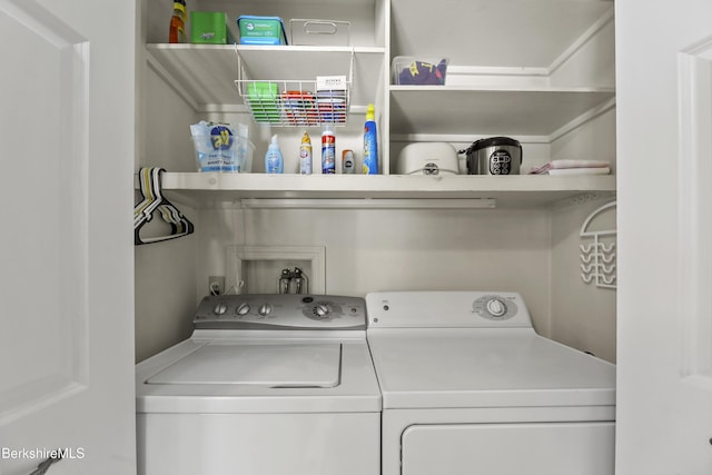 clothes washing area featuring laundry area and independent washer and dryer