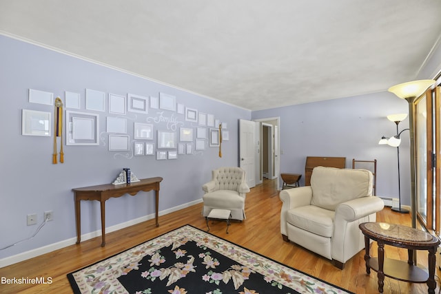 sitting room featuring wood finished floors and baseboards