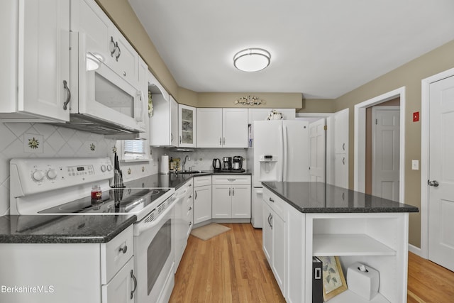 kitchen with open shelves, light wood-style flooring, decorative backsplash, white cabinets, and white appliances